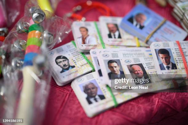 Satirical fake driving licenses featuring the face of Russian President Vladimir Putin as Adolf Hitler are seen on April 28, 2022 in Lviv, Ukraine....