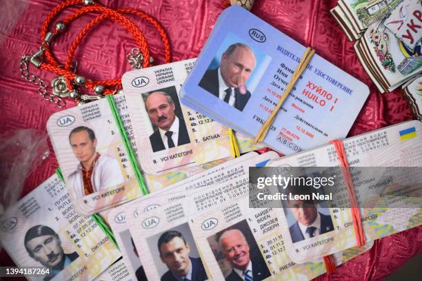 Satirical driving licenses featuring the face of Russian President Vladimir Putin with a phallic nose is seen on April 28, 2022 in Lviv, Ukraine....