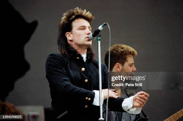 Musician and singer Bono of Irish rock band U2 performs on stage at Live Aid in Wembley Stadium, on July 13th, 1985 in London, England.