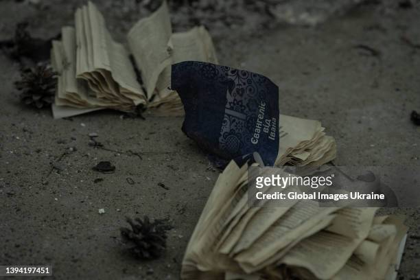 Burnt copies of 'The Gospel of John' lie on the ground on March 29 in Irpin, Ukraine. The Ukrainian army liberated the city of Irpin, near the...