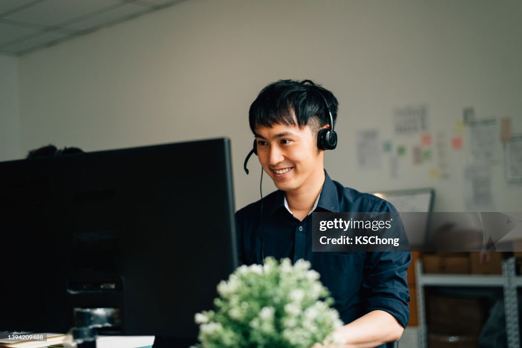Call Center Using Computer Businessman Using A Computer While Working In A Call Center High-Res ...