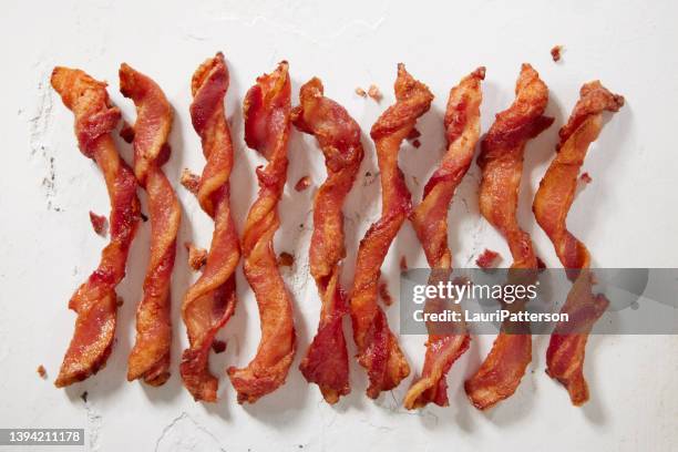 spiraled  thick cut bacon - spiral ham stock pictures, royalty-free photos & images