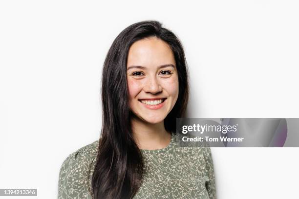 portrait of smiling woman with long, shiny brown hair - woman portrait brown hair stock pictures, royalty-free photos & images