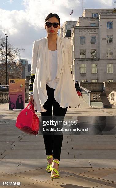 Fashion blogger Cindy Ko visiting London fashion week, wearing Sass & Bide, White jacket, American Apparel white top, Levi jeans, Elizabeth James...