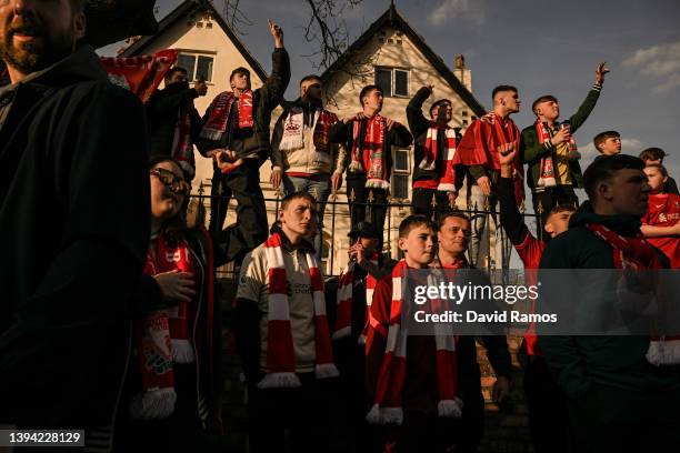 Liverpool supporters cheer and chant as they wait for the team coach arrival outside the stadium prior to the UEFA Champions League Semi Final Leg...