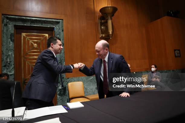 Transportation Secretary Pete Buttigieg greets Sen. Chris Coons prior to testifying before the Senate Subcommittee on Transportation, Housing and...