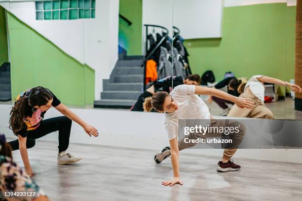 young women dancing hip-hop in a dance studio - hip hopper stock pictures, royalty-free photos & images