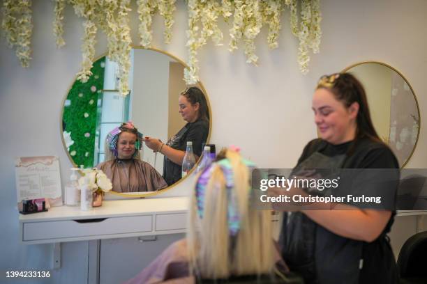 Lady has her hair styled in a salon in Dudley town centre on April 28, 2022 in Dudley, England. Local elections are to be held across the UK on May...