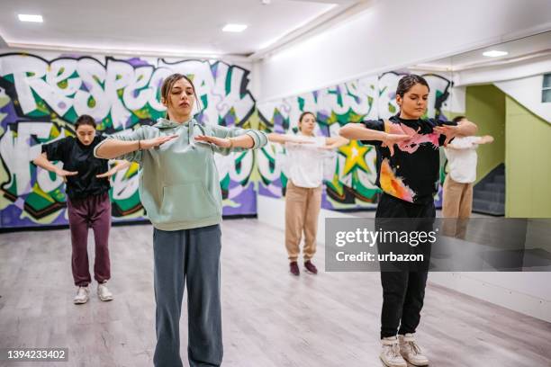 young women dancing hip-hop in a dance studio - hip hopper stock pictures, royalty-free photos & images