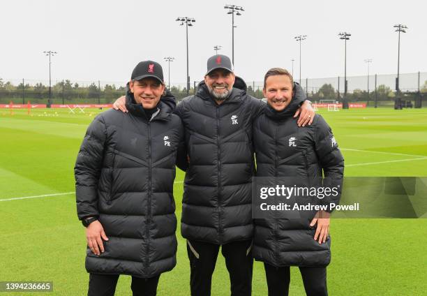 Jurgen Klopp manager of Liverpool after signing a contract extension with his coaching staff Pepijn Lijnders assistant manager of Liverpool and Peter...