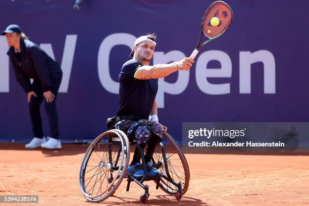 Gustavo Fernandez of Argentina plays a back hand during his first round match against Frederic Cattaneo of France at the Allianz Para Trophy on day...