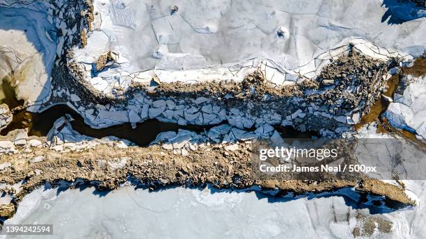 aerial over melting snow at rock quarry,united states,usa - james neal blue stock pictures, royalty-free photos & images