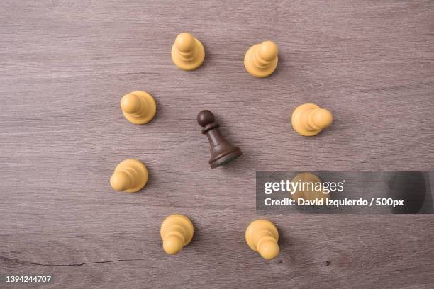 social bullying concept with chess pieces - peer pressure stock pictures, royalty-free photos & images