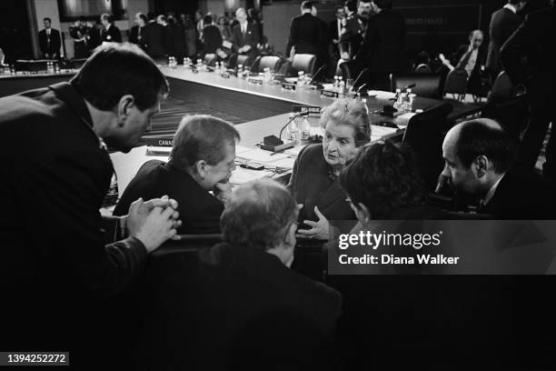 Secretary of State Madeleine Albright talks to Czech President Vaclav Havel , among others, during a NATO meeting, Washington DC, April 24, 1999.