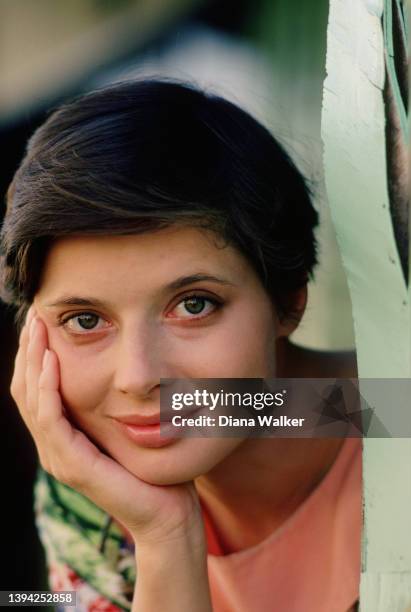Portrait of Italian model and actor Isabella Rossellini, her chin in her hand, as she smiles, Puerto Rico, April 1983. At the time she was shooting a...