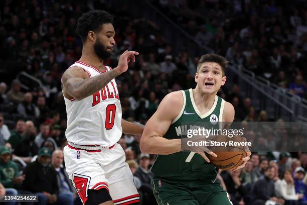 Grayson Allen of the Milwaukee Bucks is defended by Coby White of the Chicago Bulls during Game Five of the Eastern Conference First Round Playoffs...