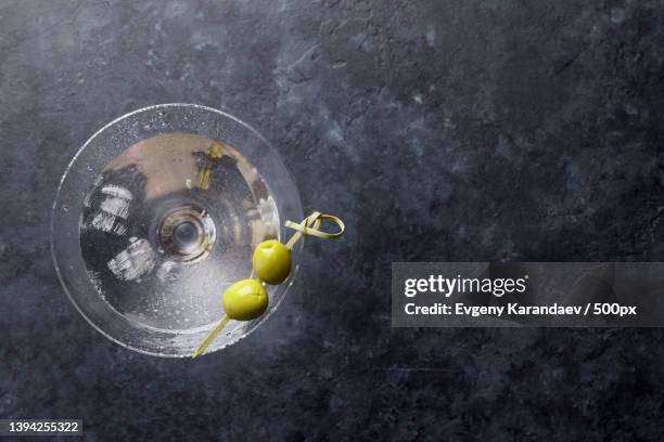 martini cocktail,directly above shot of fruits in container on table - dirty martini stockfoto's en -beelden