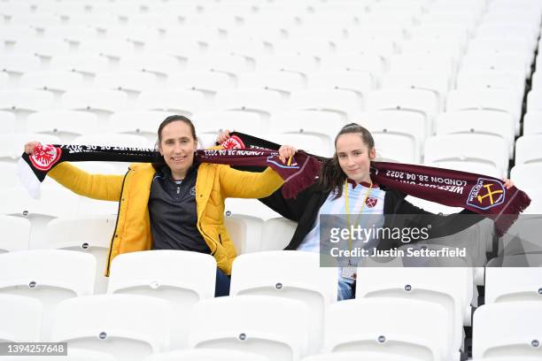 West Ham United fans hold up scarves and pose for a photograph prior to the UEFA Europa League Semi Final Leg One match between West Ham United and...