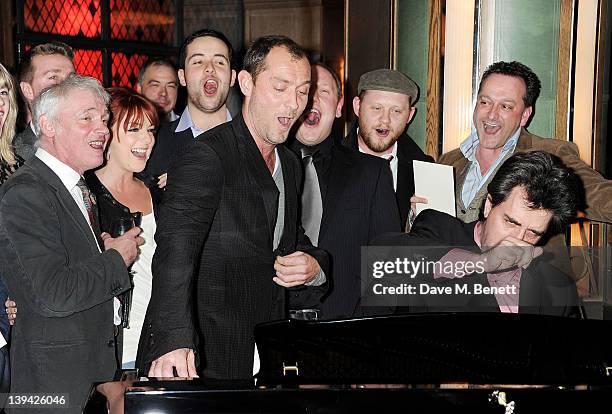 Founder Jeremy James Taylor, Sheridan Smith and Jude Law sing with guests at the National Youth Music Theatre bursary scheme launch at The Ivy on...
