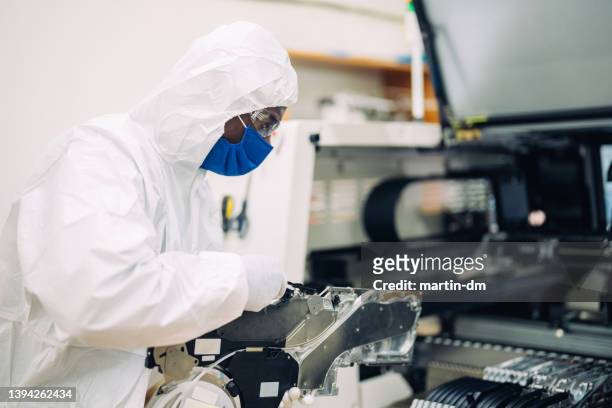 production factory - white suit stock pictures, royalty-free photos & images
