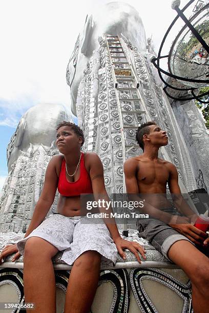 Brazilians rest while working on a float during Carnival celebrations on February 20, 2012 in Rio de Janeiro, Brazil. Carnival is the grandest...