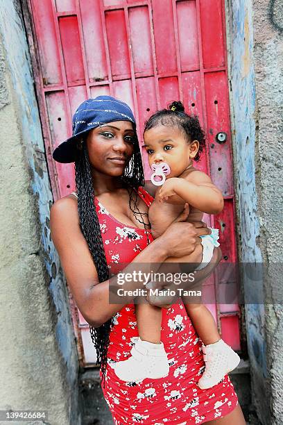 Brazilians pose during Carnival celebrations on February 20, 2012 in Rio de Janeiro, Brazil. Carnival is the grandest holiday in Brazil, annually...