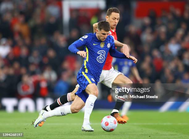 Mason Mount of Chelsea is challenged by Nemanja Matic of Manchester United during the Premier League match between Manchester United and Chelsea at...