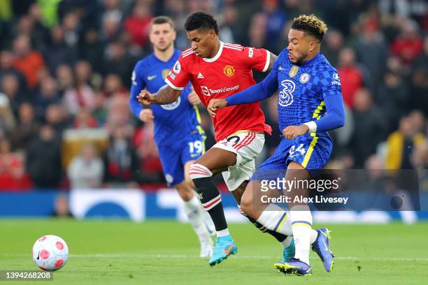 Marcus Rashford of Manchester United is challenged by Reece James of Chelsea during the Premier League match between Manchester United and Chelsea at...