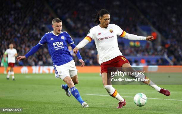 Chris Smalling of AS Roma is challenged by Jamie Vardy of Leicester City during the UEFA Conference League Semi Final Leg One match between Leicester...