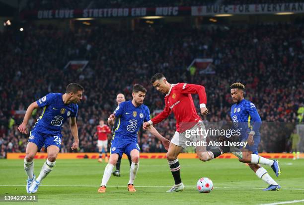 Cristiano Ronaldo of Manchester United is challenged by Reece James, Cesar Azpilicueta and Jorginho of Chelsea during the Premier League match...