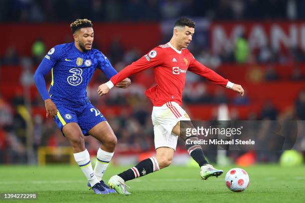 Cristiano Ronaldo of Manchester United runs with the ball from Reece James of Chelsea during the Premier League match between Manchester United and...