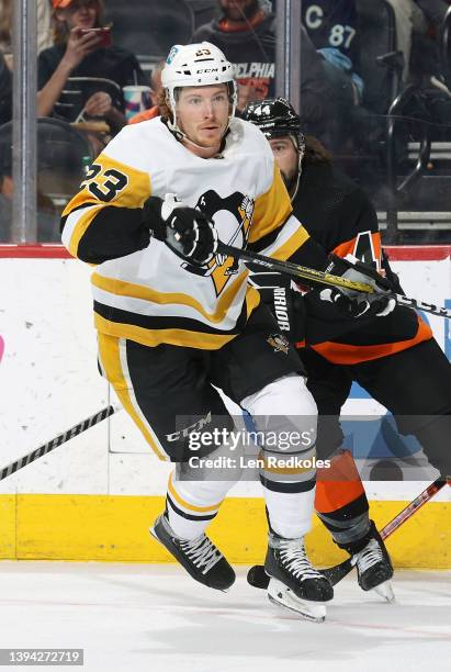 Brock McGinn of the Pittsburgh Penguins skates against Nate Thompson of the Philadelphia Flyers at the Wells Fargo Center on April 24, 2022 in...