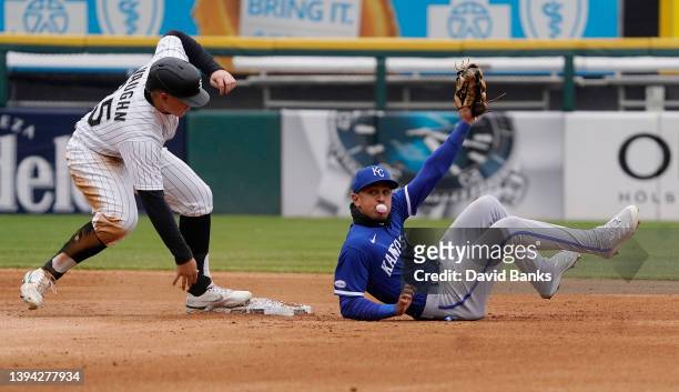 Nicky Lopez of the Kansas City Royals tags out Andrew Vaughn of the Chicago White Sox at second base during the fourth inning at Guaranteed Rate...