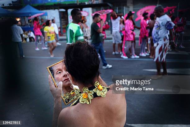 Brazilian reveller dons makeup during Carnival celebrations on February 20, 2012 in Rio de Janeiro, Brazil. Carnival is the grandest holiday in...