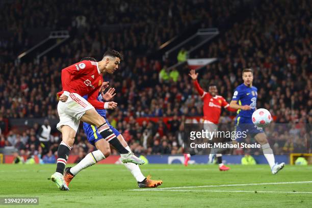 Cristiano Ronaldo of Manchester United scores their team's first goal during the Premier League match between Manchester United and Chelsea at Old...