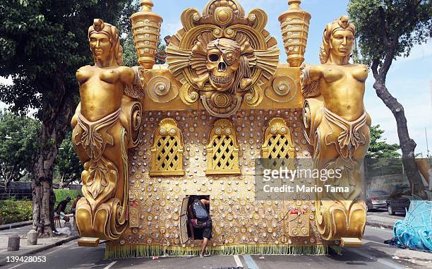 Worker stands in the entry of a float during Carnival celebrations on February 20, 2012 in Rio de Janeiro, Brazil. Carnival is the grandest holiday...
