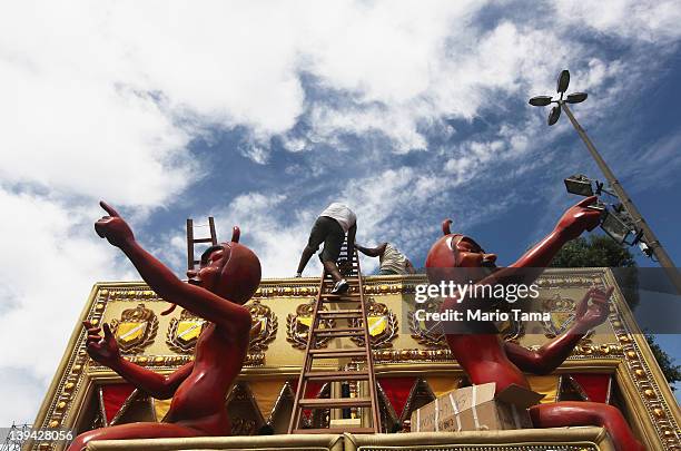 Brazilians work on a float during Carnival celebrations on February 20, 2012 in Rio de Janeiro, Brazil. Carnival is the grandest holiday in Brazil,...