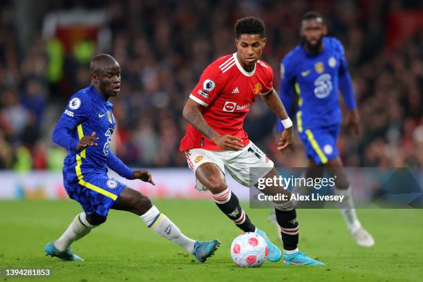 Marcus Rashford of Manchester United is challenged by Ngolo Kante of Chelsea during the Premier League match between Manchester United and Chelsea at...