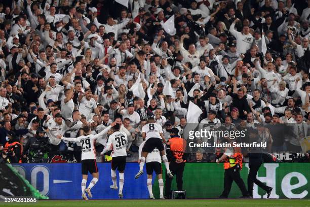 Daichi Kamada of Eintracht Frankfurt celebrates with team mates and fans after scoring their sides second goal during the UEFA Europa League Semi...