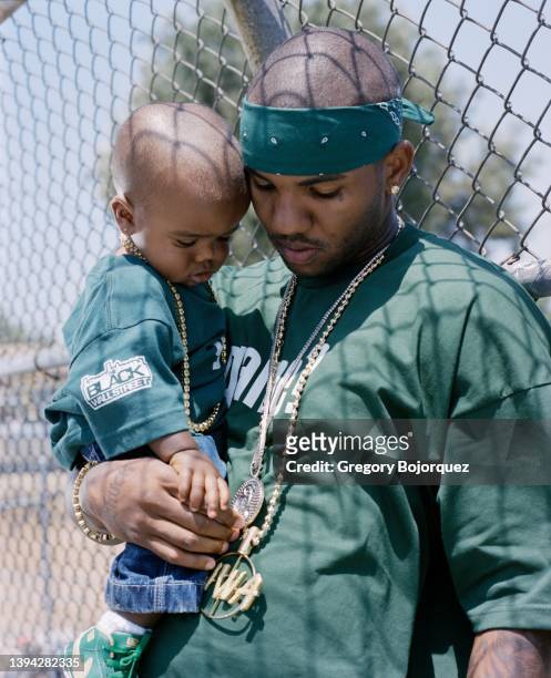 Rapper The Game and his son in July, 2004 in Compton, California.