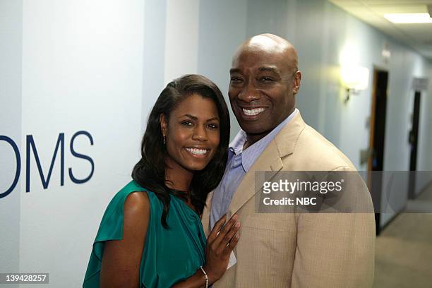 Episode 4202 -- Pictured: Omarosa Manigault-Stallworth and actor Michael Clarke Duncan backstage on February 20, 2012 --