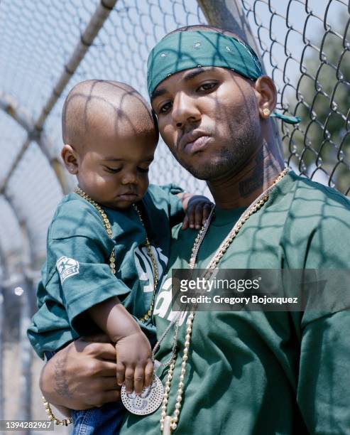 Rapper The Game and his son in July, 2004 in Compton, California.