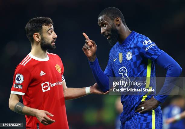 Antonio Ruediger of Chelsea clashes with Bruno Fernandes of Manchester United during the Premier League match between Manchester United and Chelsea...