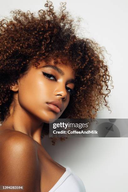 beautiful afro girl with curly hairstyle - glamour girl stock pictures, royalty-free photos & images