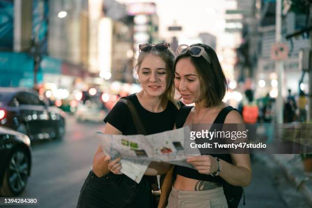 young women travel at bangkok china town night market - young couple exploring city stock pictures, royalty-free photos & images