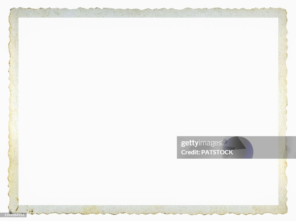 An old stained photographic paper frame.