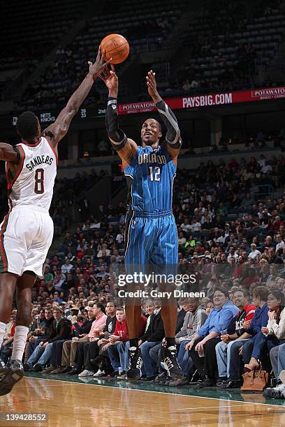 Larry Sanders of the Milwaukee Bucks blocks a shot by Dwight Howard of the Orlando Magic during the game on February 20, 2012 at the Bradley Center...