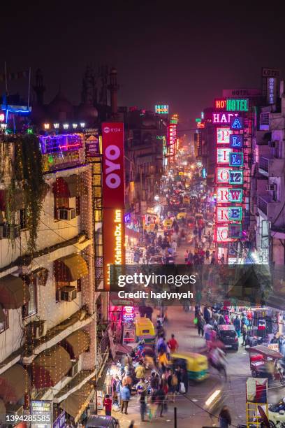 city life- main bazar by night, paharganj, new delhi, india - new delhi street stock pictures, royalty-free photos & images