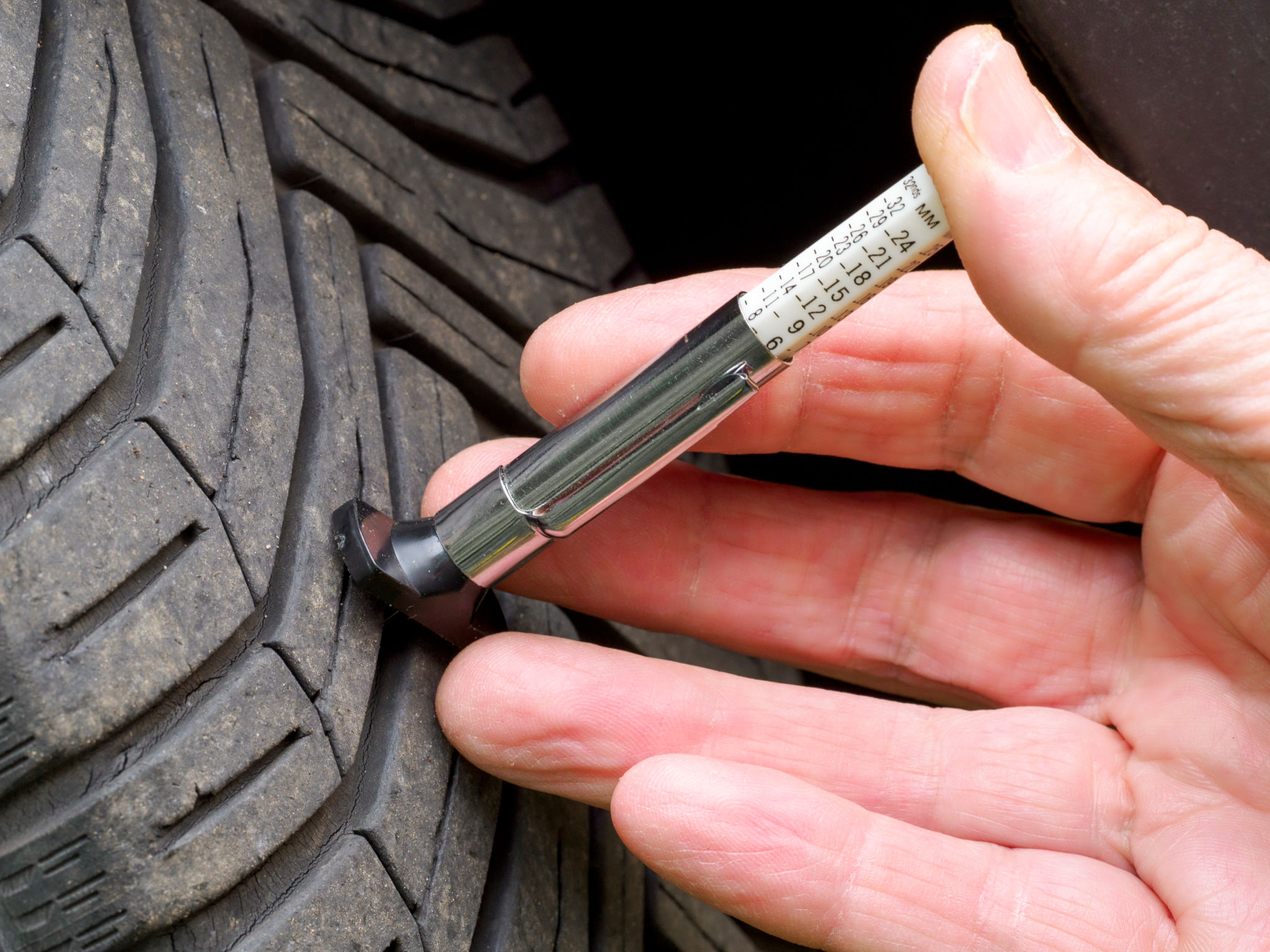 mechanic checking tires