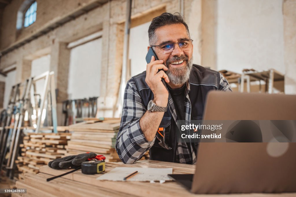 Carpenter in wood workshop